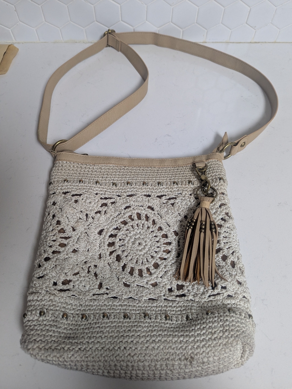 The SAK -Beige Crochet Crossbody Bag with Tassel
